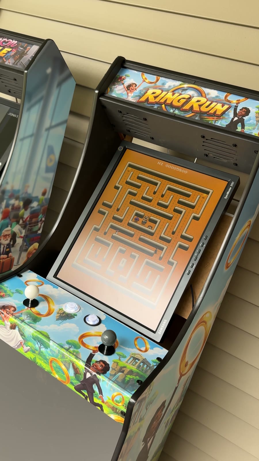 Ring Run arcade cabinet — full-height cabinet with custom side art and the maze on screen